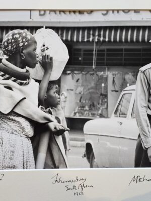 Where's your pass, South African policeman in street by Michael Joseph