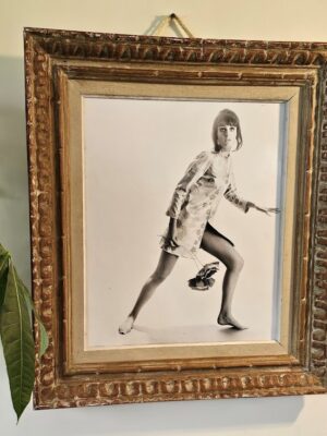 Jovial model, barefoot with big flowers, authentic darkroom print by Michael Joseph in an upcycled copper tint wooden frame