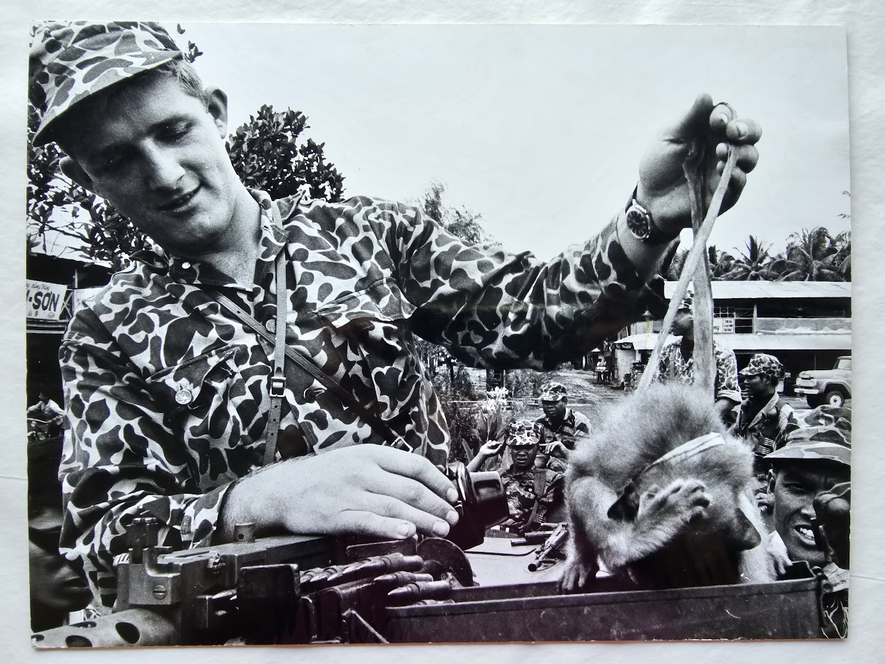 Soldier and animal on lead in Saigon, taken during Vietnam war, 1965 authentic darkroom print by Michael Joseph
