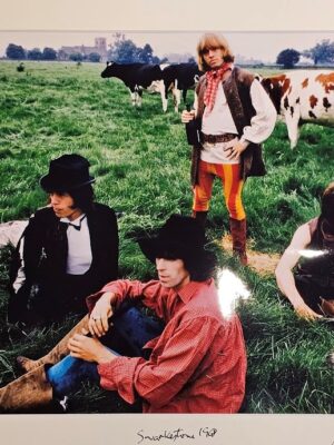Rolling Stones and Cows in the grass at Swarkestone, June 1968, Mick Jagger and colleagues relaxing by Michael Joseph