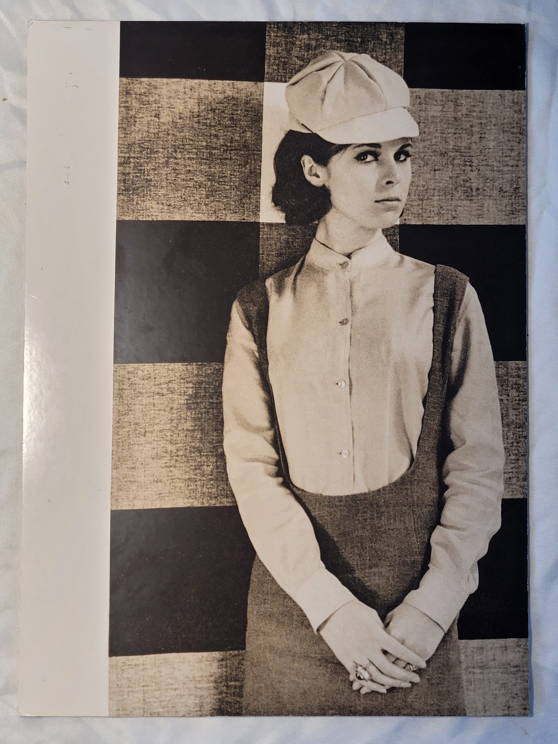 Pretty brunette with hat in front of geometric wallpaper, by Michael Joseph – Image 2