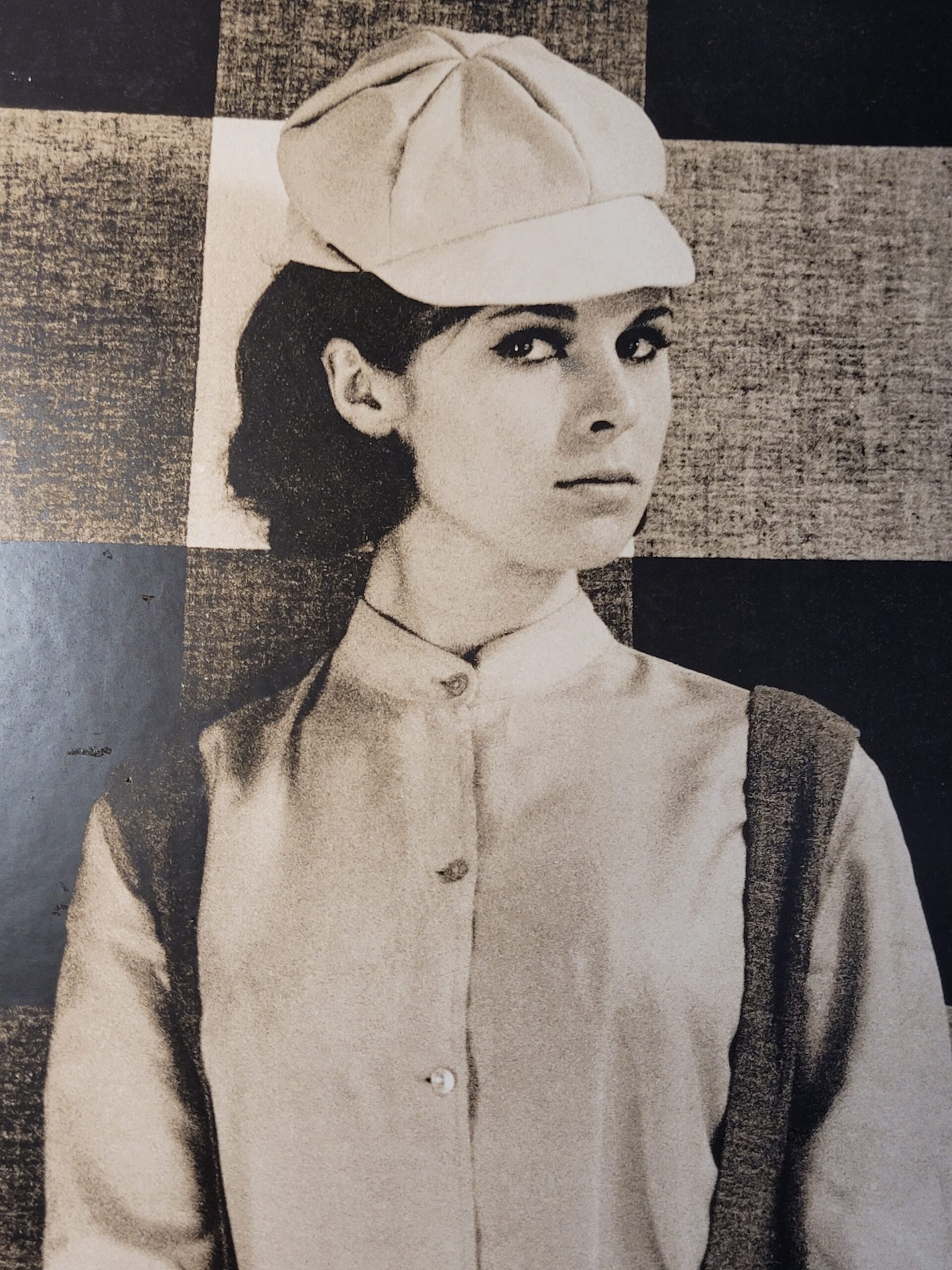 Pretty brunette with hat in front of geometric wallpaper, by Michael Joseph – Image 5