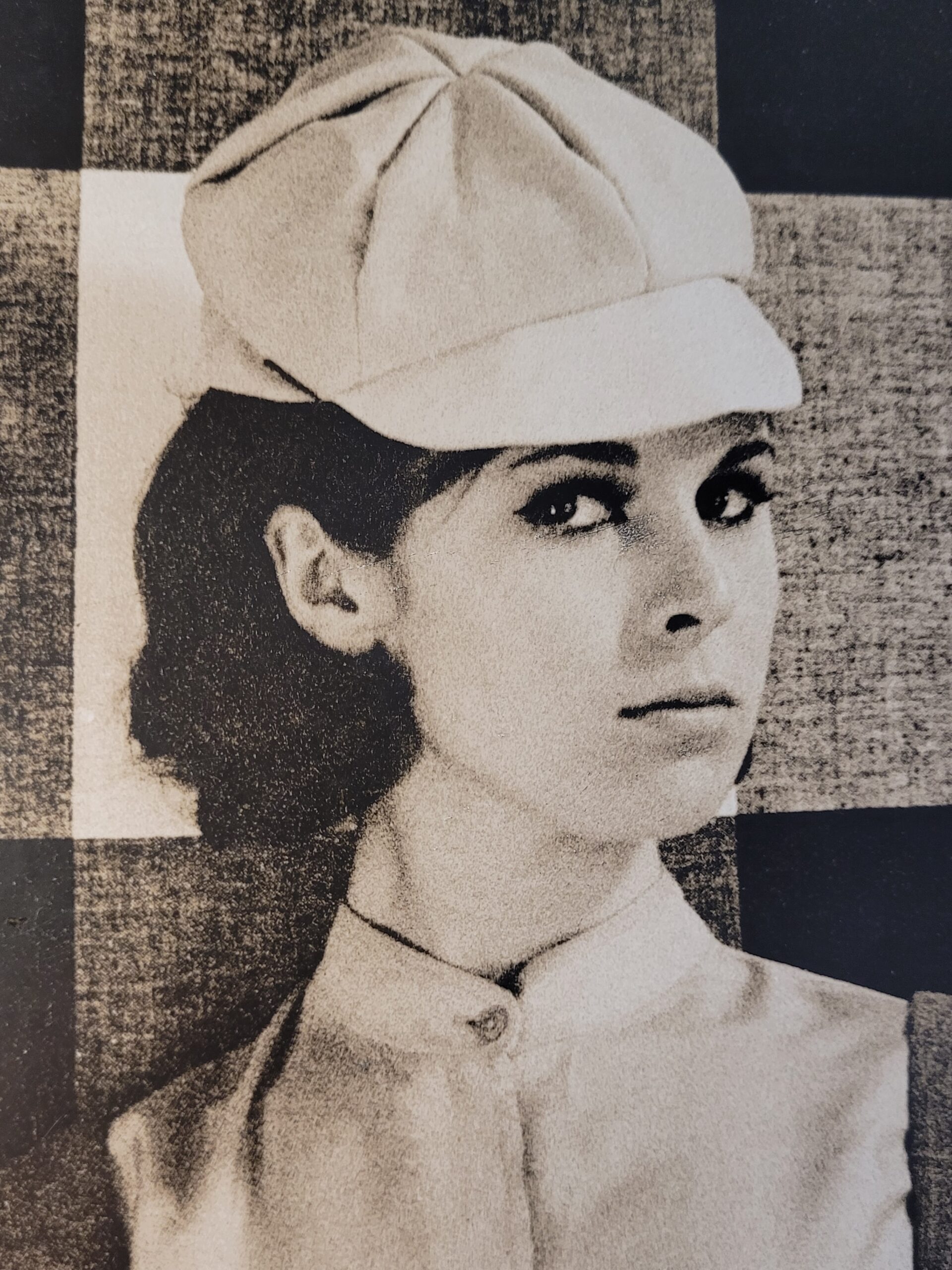 Pretty brunette with hat in front of geometric wallpaper, by Michael Joseph – Image 4