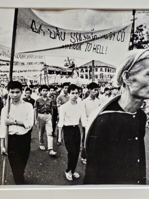 Calm student rally Saigon people protesting in the street during the Vietnam War by Michael Joseph