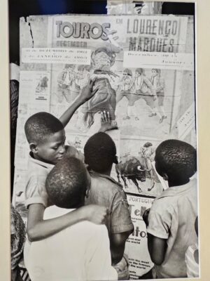 African children looking at a bullfighting poster by Michael Joseph