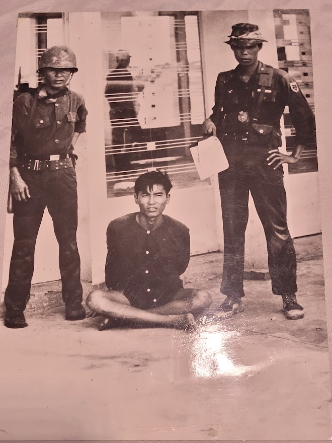 South Vietnam, soldiers with prisoner, poignant photograph taken in 1964 by Michael Joseph