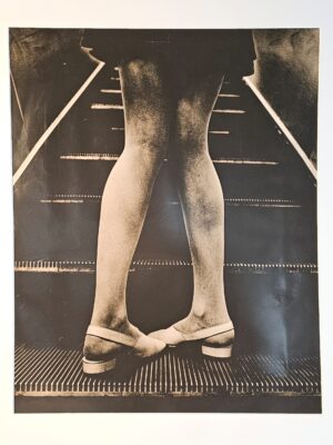 Unknown model's legs in tights on underground (Mary Quant out-take) by Michael Joseph