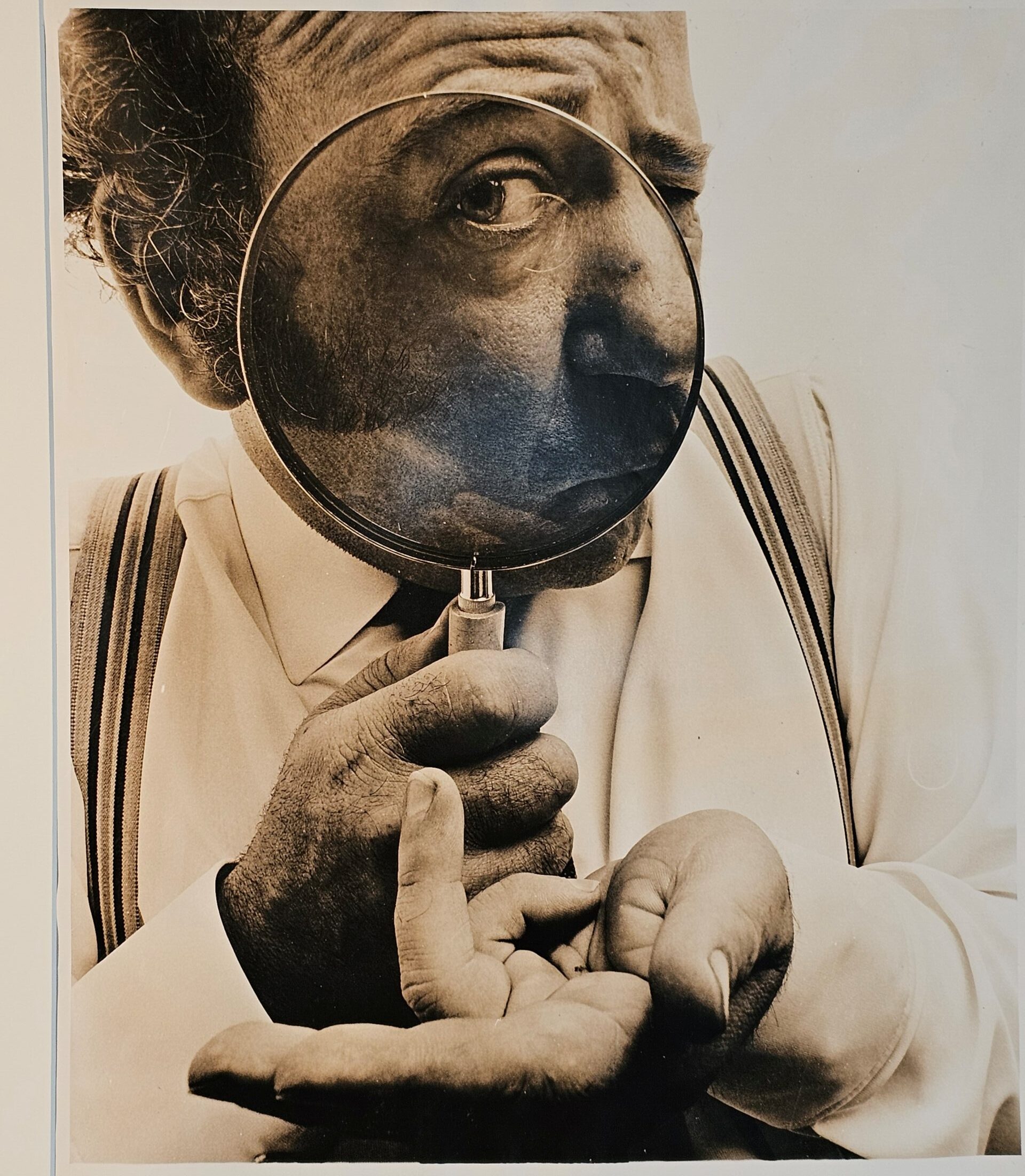 Sid James wiggling - his finger through his flies - full height studio portrait by Michael Joseph