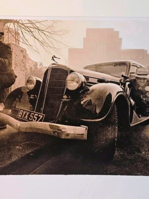 Esso getaway - men toting machine guns in the East end of London in the sixties by Michael Joseph
