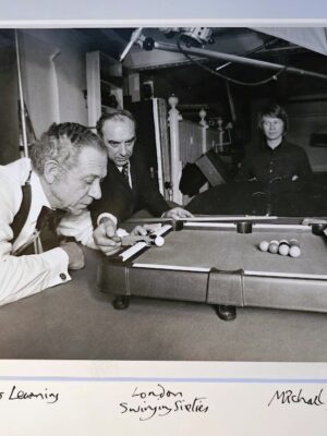 Sid James playing pool on a mini table, test-print for an advert by Michael Joseph