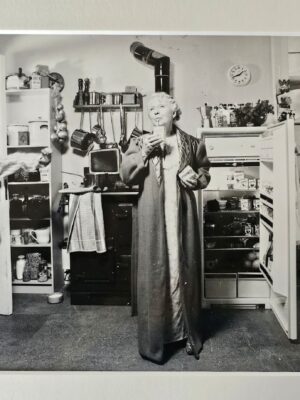 Child enters kitchen to catch Granny having a midnight snack by Michael Joseph