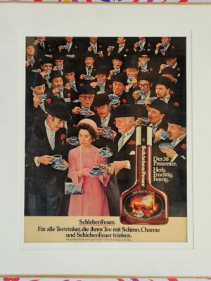 Sneaky sloe gin in tea, Queen lookalike with men in bowler hats for Schlehen Feuer, laminated ad under glass by Michael Joseph