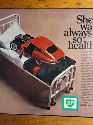 BP Red Car on hospital bed Laminated advert (by Michael Joseph)