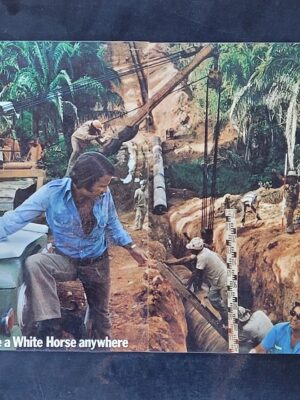 White Horse Whisky Excavation you can take a white horse anywhere Laminated advert (by Michael Joseph)