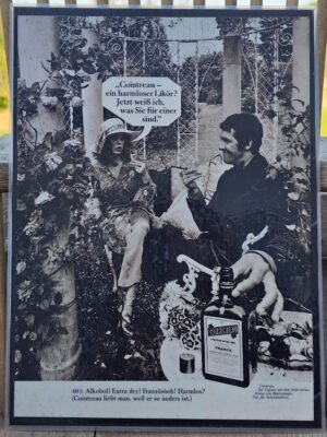 Couple drinking in rose garden, harmless liqueur Cointreau, ad by Michael Joseph